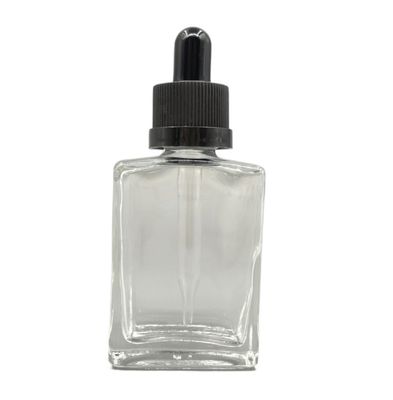 正方形30mlのガラス化粧品はヘアー ケア オイルのための点滴器のChildproof帽子をびん詰めにする