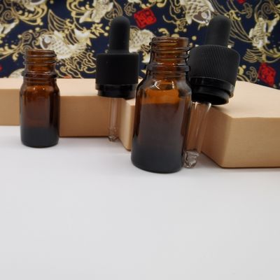 100mlこはく色のガラス化粧品は子供を保護するために点滴器のラチェットの閉鎖をびん詰めにする